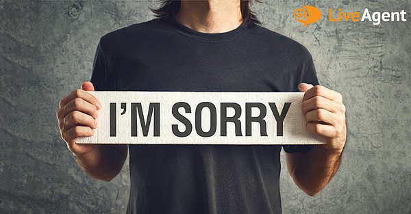 Man holding I'm sorry sign